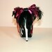 Zebra peeptoe pump with satin bow and feathers