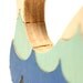 Puzzle whale. Children's game, wood toy, wooden puzzle, whale puzzle with waves.