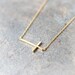 Sideways Cross Necklace in gold