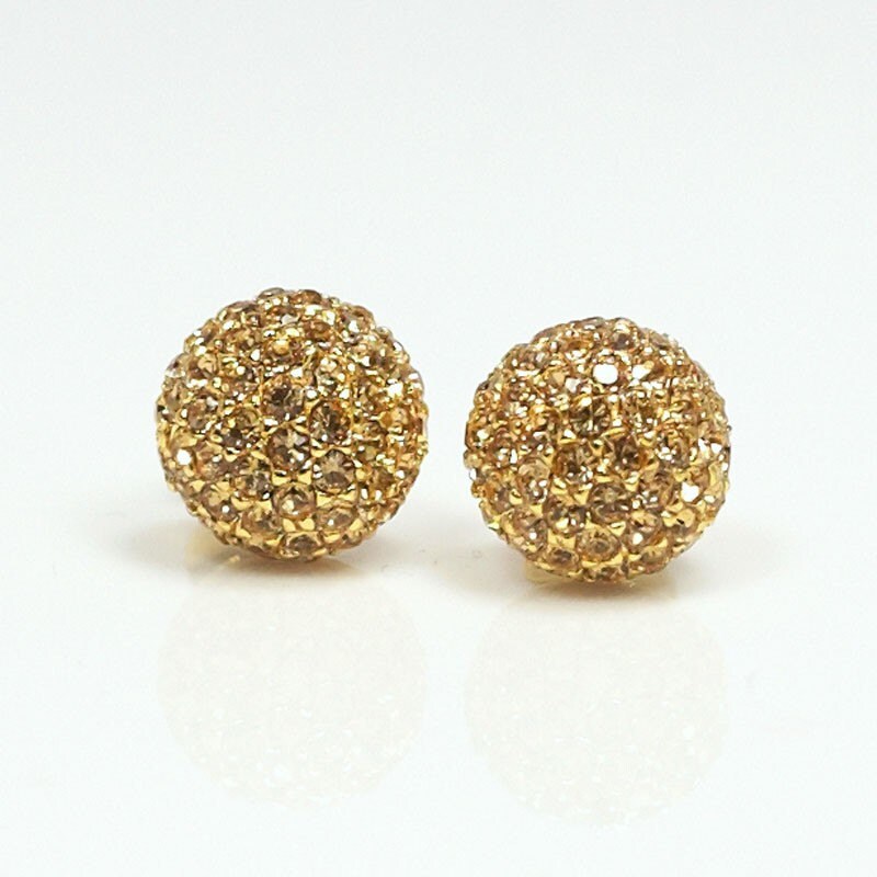 Items similar to shiny disco ball earrings / gold on Etsy