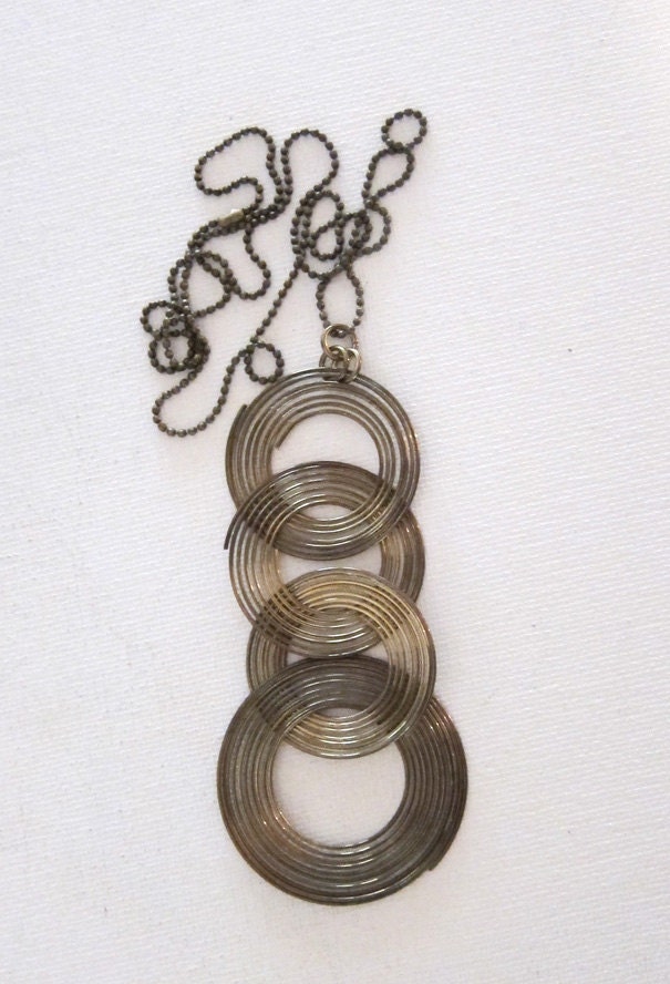 Vintage retro groovy 1970s tribal brass ring pendant