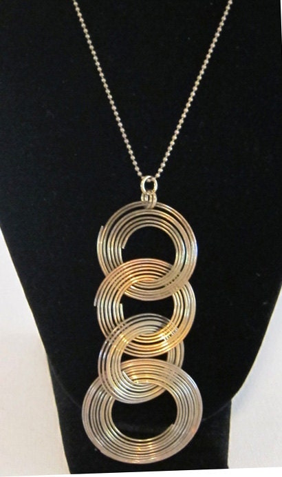 Vintage retro groovy 1970s tribal brass ring pendant