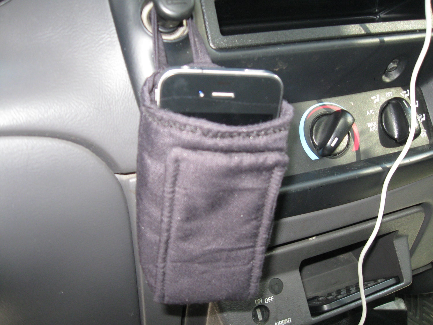 Black IPod Pocket, Telephone or Sunglass Holder or Pouch for in your Car at your desk mesures 4-1/2 inches Tall with a 2 inch depth