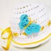 White crocheted baby hat "Blue Butterfly" from cotton yarn