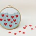 Embroidery hoop wall art Cloudy rain of hearts - Made to order