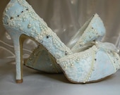 Something Blue ...baby blue lacey wedding shoes..you choose the style and height.