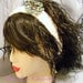 White Crochet Headband with A Black/Blue/Green Ribbon Crochet Flower, with ties for fit
