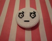Look of Disapproval Cross Stitch Pin