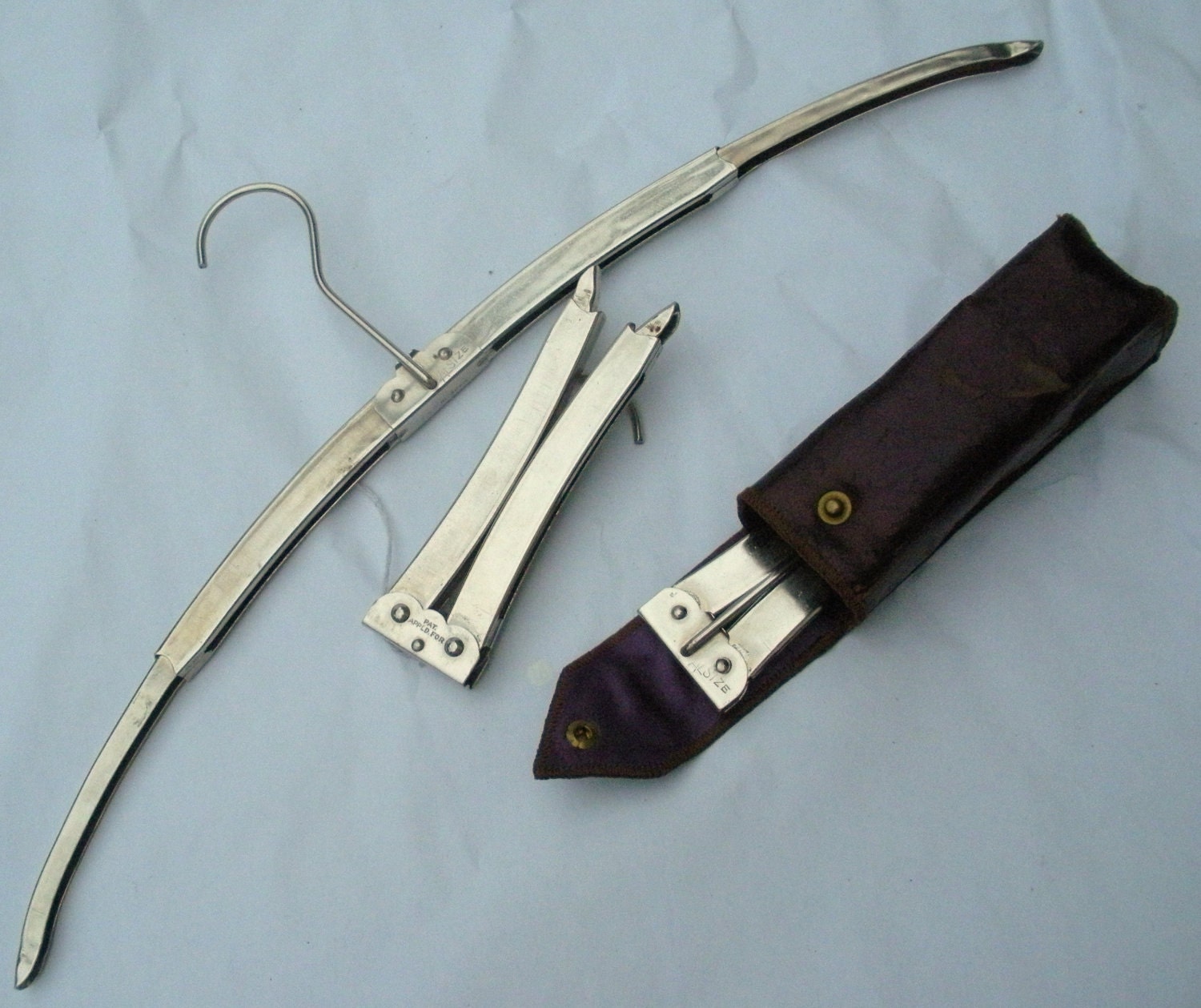 Vintage folding hanger in satin case