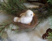 White felt bird in nest