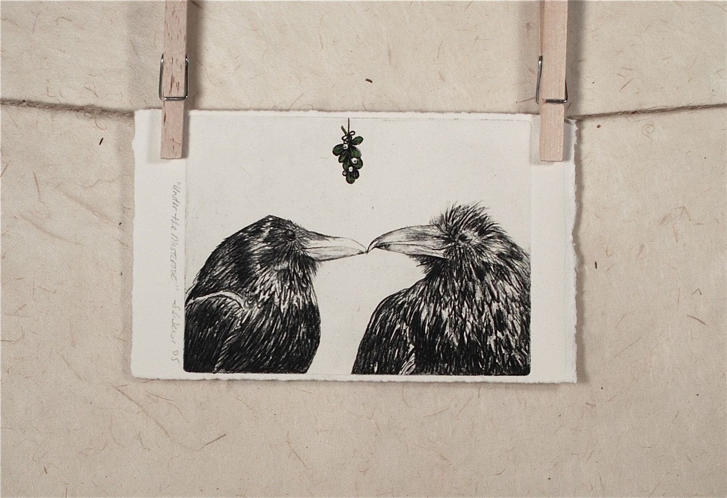 Love...The Kiss:  Raven Etching Under the Mistletoe