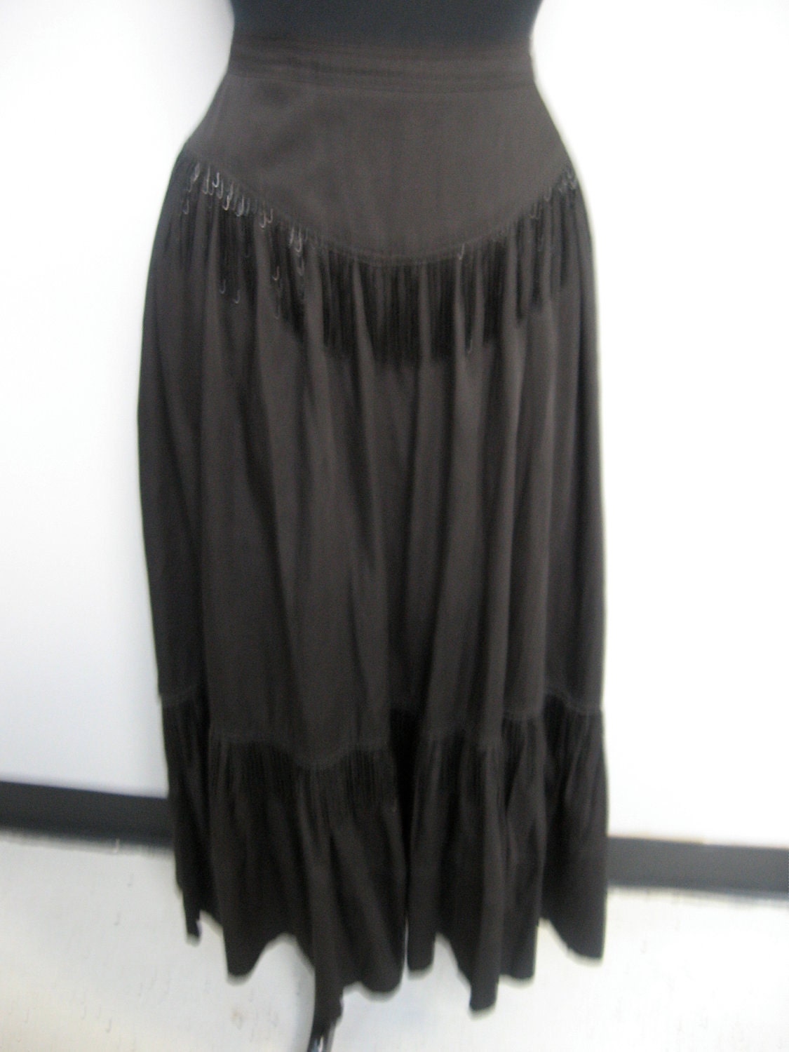 1980's black long skirt with bottom ruffle and beaded fringe by Gene Ewing for Bis