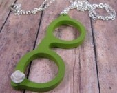 green wooden glasses, tiny white rose on silver chain