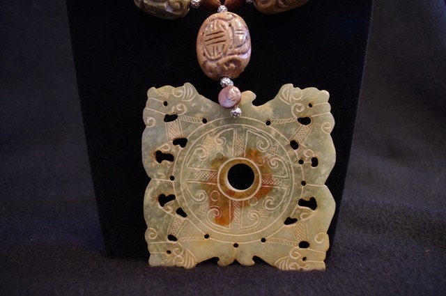 Carved jade dragon pendant with carved beads and bronze pearls