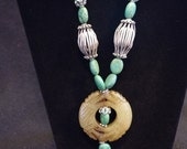 Turquoise necklace with carved agate pendant