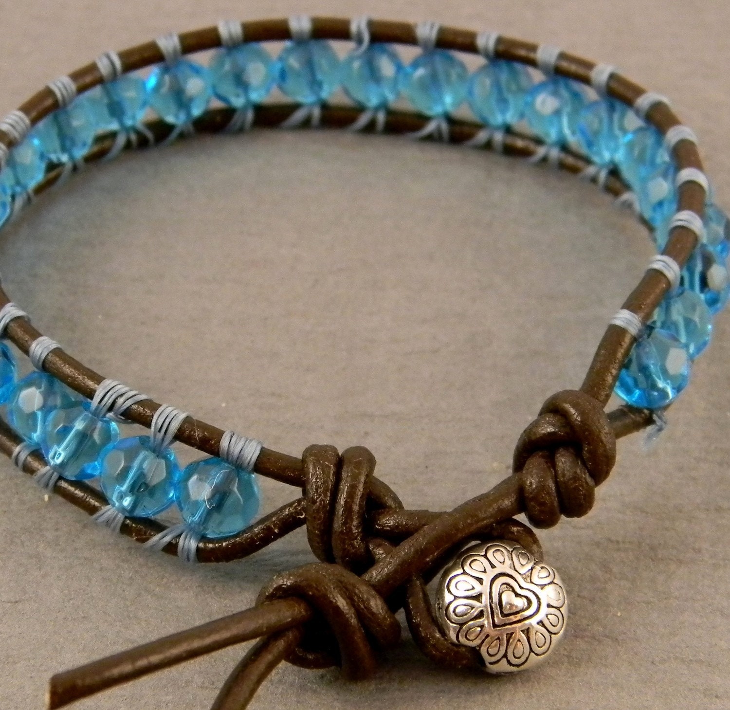 Woven leather bracelet with glass beads