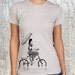 Women's T-Shirt - Vintage Styled Photo of a Woman on a Bike with Umbrella