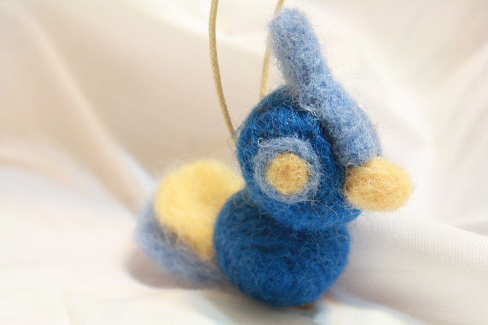 wide-eyed blue and yellow needle felted bird ornament