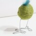 olive green big-footed bird