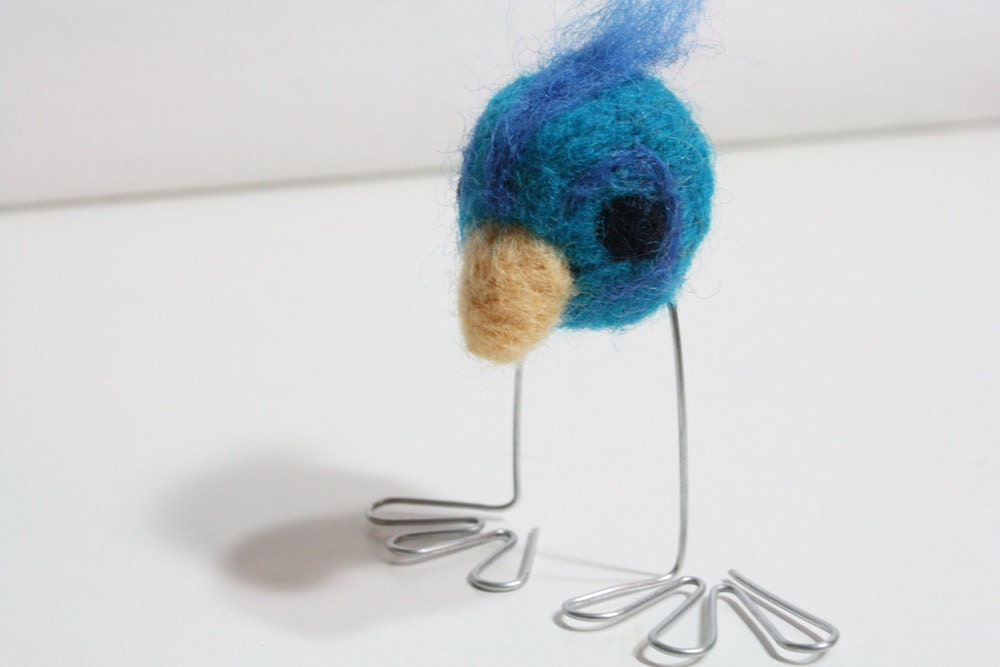 blue and turquoise big-footed bird
