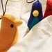 set of red, blue and yellow "banana bird" felt ornaments