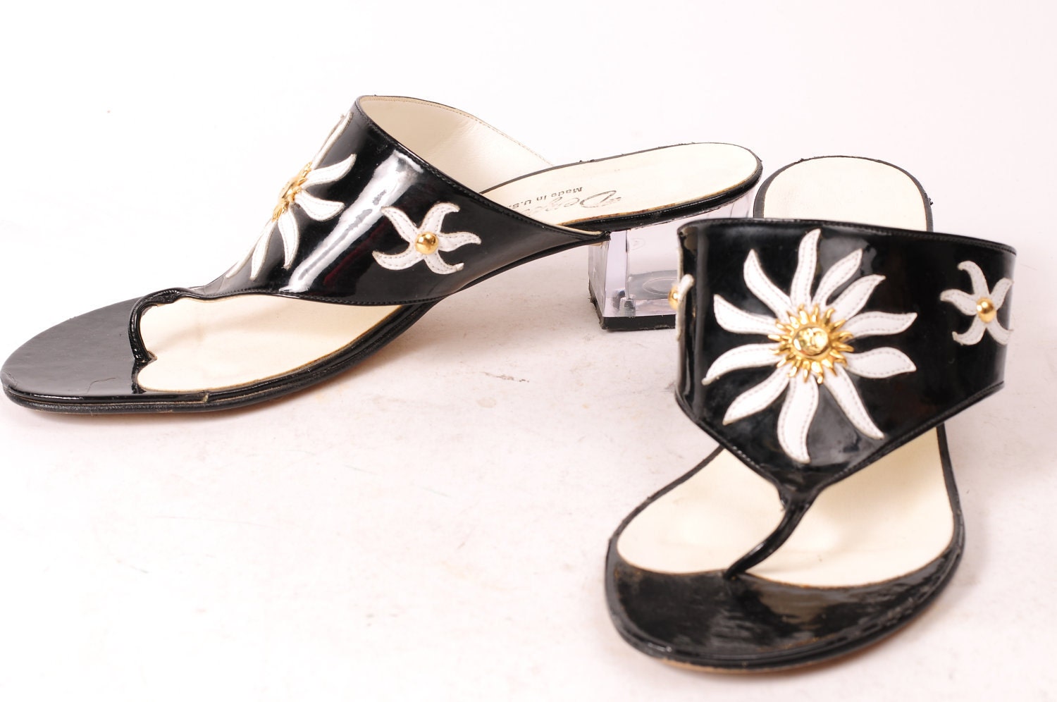 1980's Dezaria Black Patent Leather pumps - white sunburst design, gold sun and clear heels - Size 6