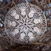 Delicate eye-catching crochet window or wall hanging with a small crystal