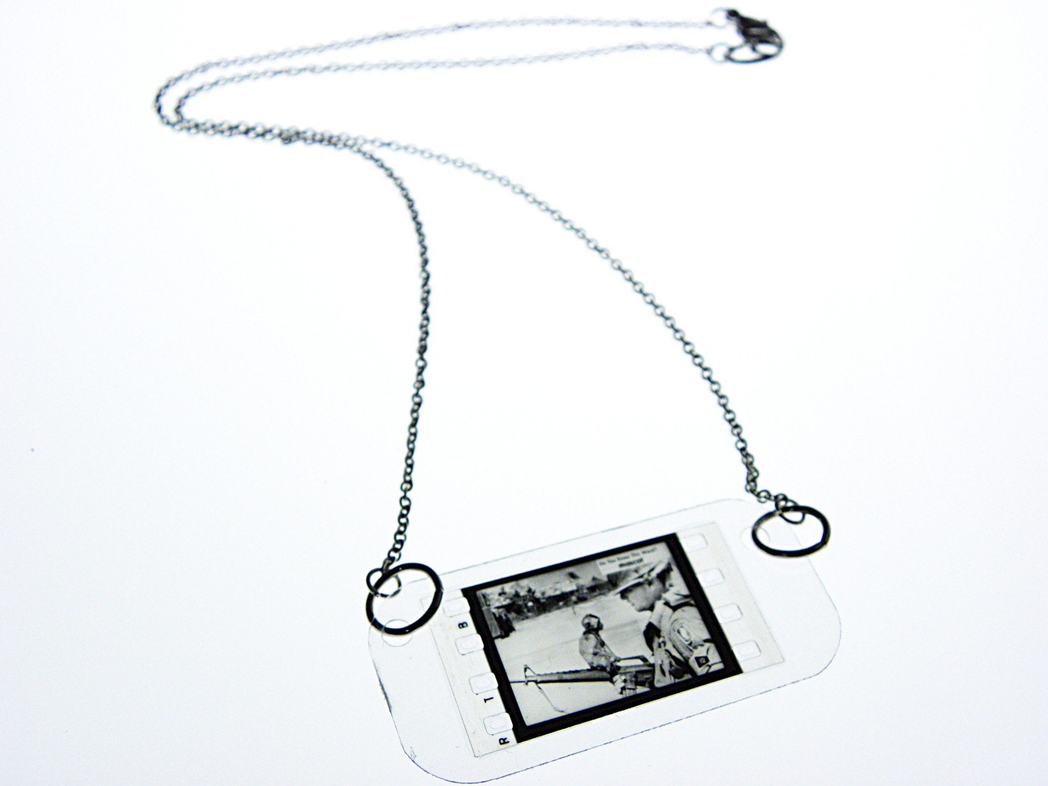 vintage newsreel film necklace . mascot