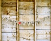 Just Married burlap Banner In Old Type Face Lettering.