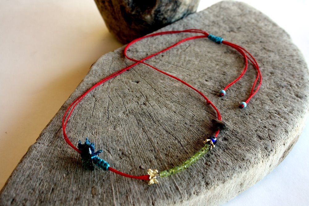 lovely driftwood and peridot necklace with traditional turkish needle lace on a red cotton cord...unique and one of a kind