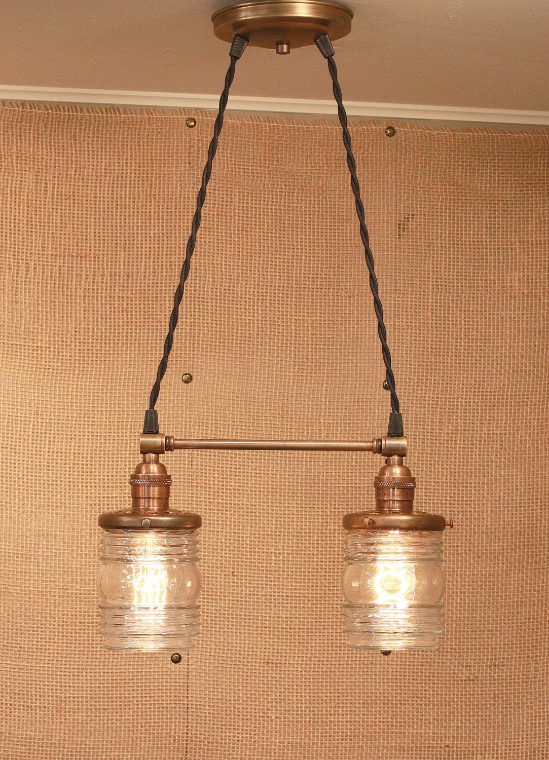 Chandelier Lighting with Twin Glass Shades and Antique Brass Spreader Bar and Black Twisted Wire