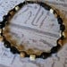 Black friendship bracelet in hemp.