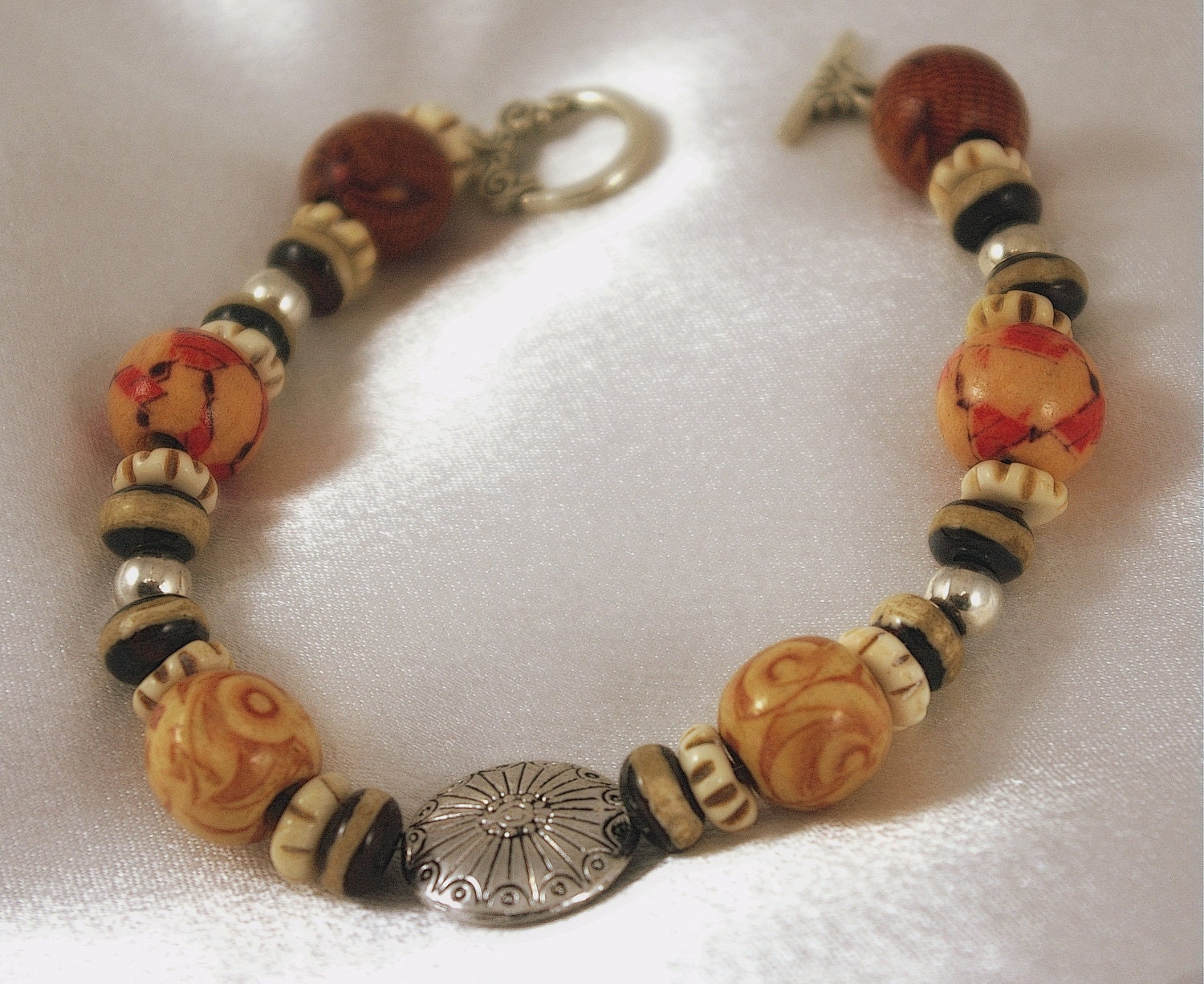 Finely Crafted Bracelet of Dyed Wooden Beads, DZI Beads, and Bone Rondelles.  Classically Designed.