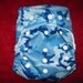 SassyCloth one size pocket diaper with blue camo PUL print. Made to order.