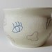 Mixed-Up Face bowl: Lips, eyes, nose, eyebrows all over the place....
