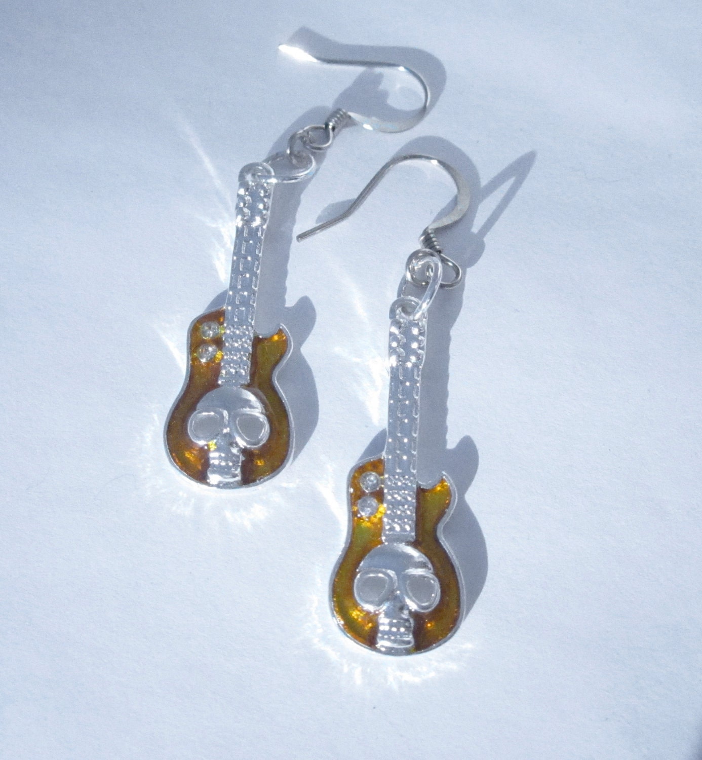 ROCKER amber and silver skull guitar earrings