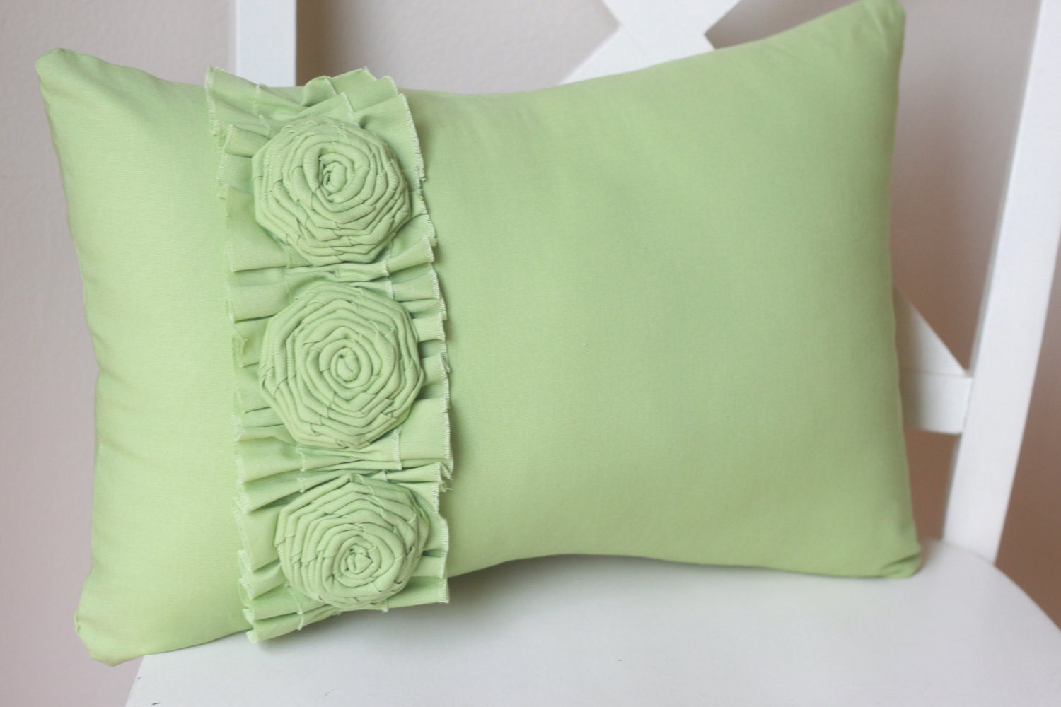 Green Pillow with Frayed Ruffle and Three Roses