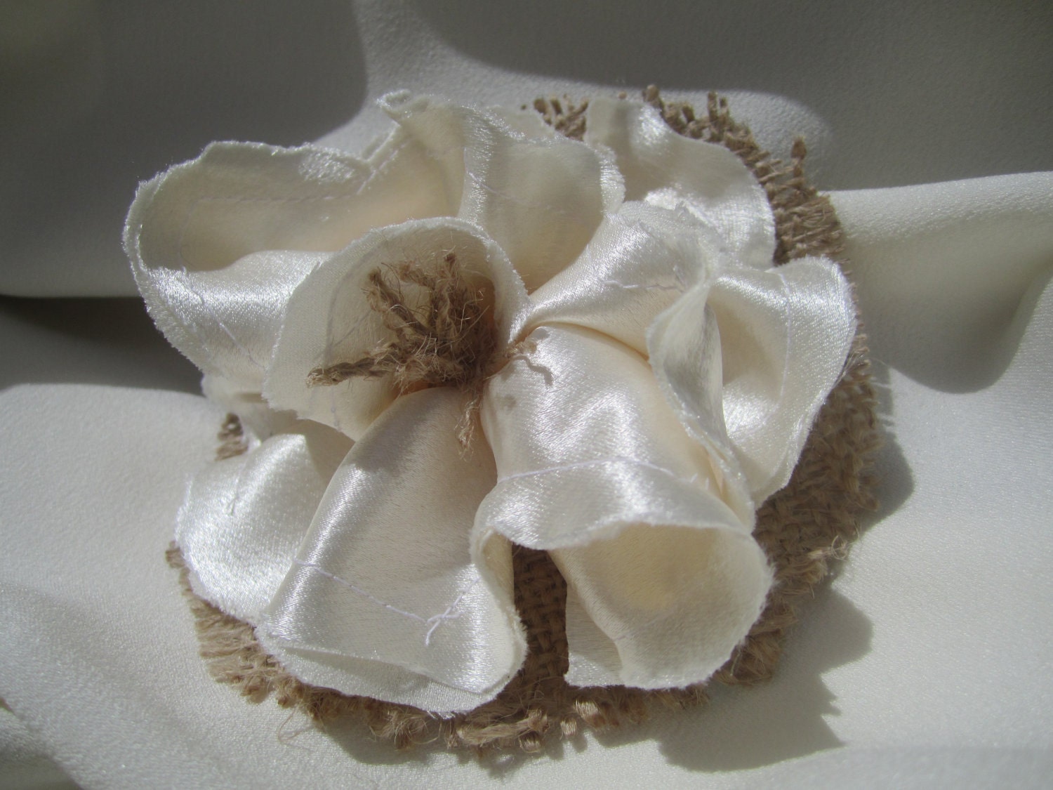 Beautiful burlap flower satin hair accessory in a soft and lovely crepe back satin fabric