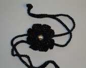 Black speckled crocheted flower headband