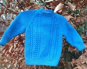 Boy's blue cable sweater