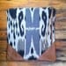 T R A V E L collection Leather and cotton clutch, cream color