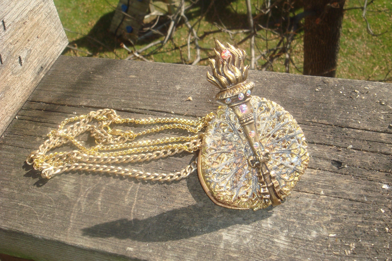 The Hunger Games Torch /Web Brooch Locket/Encrusted swarovski s stones / Picture Locket /Necklace Pendant Gold Leafed /OOAK /Re-purposed