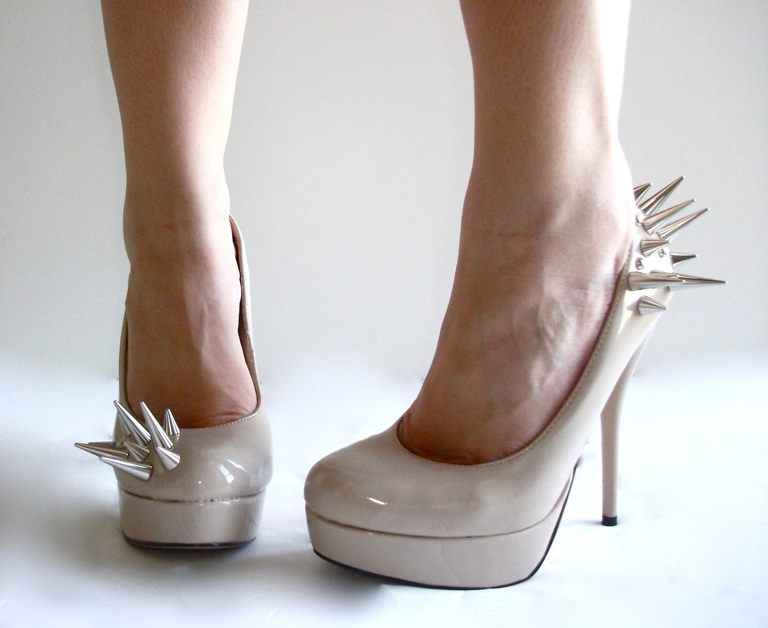 Asymmetrical Spiked Patent Leather Pumps - Nude