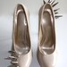 Asymmetrical Spiked Patent Leather Pumps - Nude