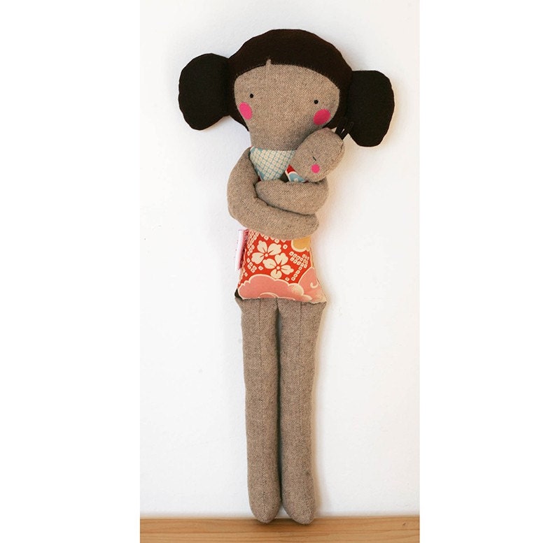 Mother carrying baby with a foulard