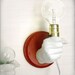 Hand Holding Bulb Wall Lamp (Red)