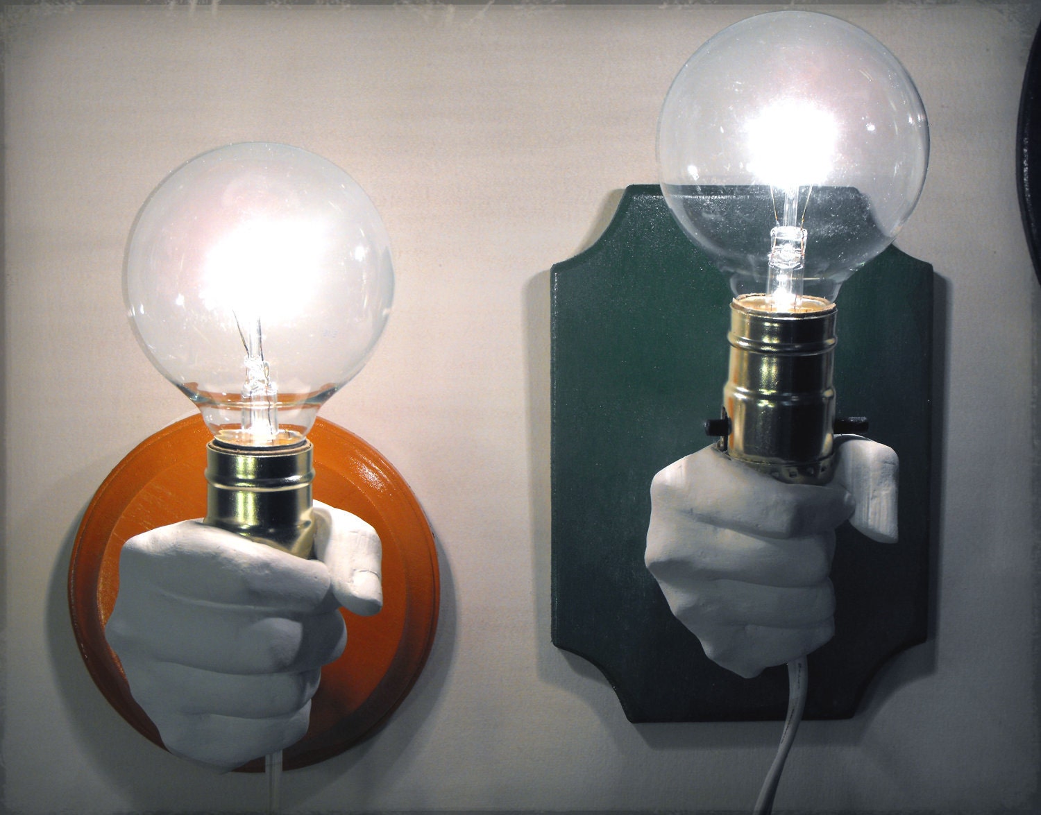 Hand Holding Bulb Wall Lamp (Orange)