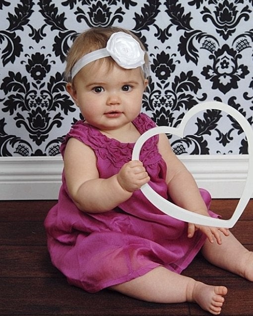 Beautiful layered WHITE satin flower headband. Hand cut, sewn and singed. Beaded pearl center.  Fits toddler to adult.