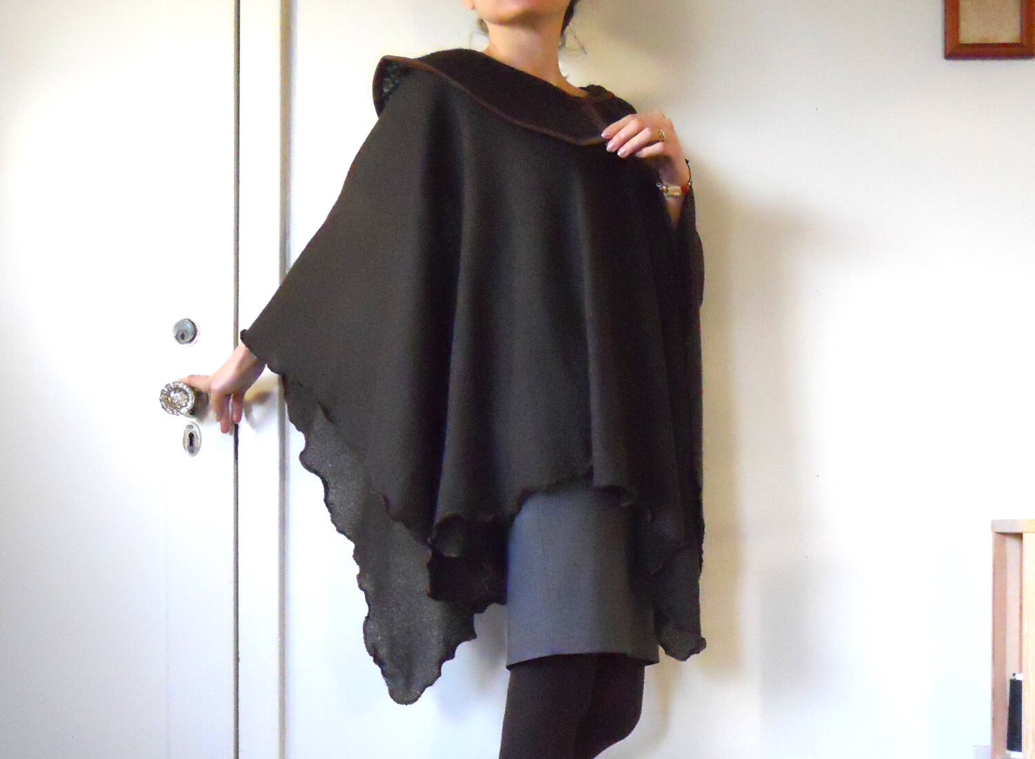 Cape poncho in chocolate color with asymmetric collar made of sweater knit fabric