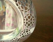 Round silver coaster.